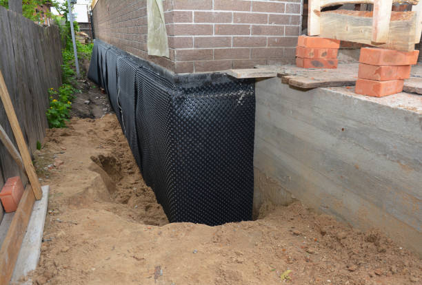 SJ Waterproofing Pros technician performing targeted Exterior Waterproofing assessment in Liberty, IN